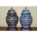 Pair Chinese blue and white baluster vases and covers, 30cm.