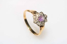 Amethyst and diamond cluster 18 carat white gold ring, size O.