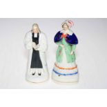 John Wesley and female Staffordshire figures, 19cm and 20cm.