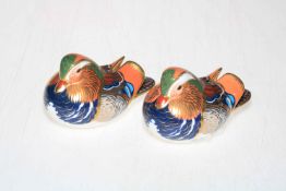 Two Royal Crown Derby Mandarin Duck paperweights.