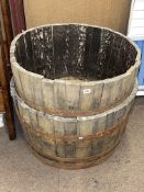 Pair of coopered oak and metal bound half barrel planters.