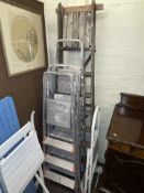 Three sets of aluminium step ladders, wooden step ladder and folding sack barrow step ladder combo.