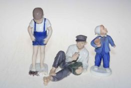 Three Bing & Grondahl and Royal Copenhagen figures, Boy with Crab, Reclining Male and Boy,