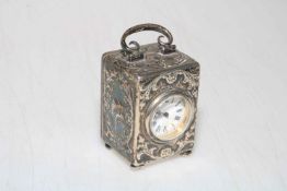 William Comyns silver boudoir clock, having embossed decoration and with French movement, 9.