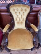 Victorian mahogany framed nursing chair upholstered in yellow buttoned draylon.