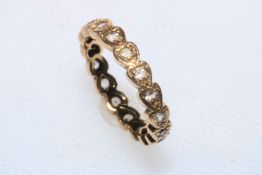 9 carat gold white stone eternity ring, size K.