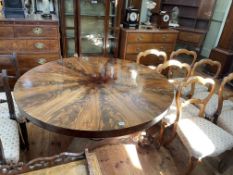 Good quality Victorian figured walnut circular breakfast table raised on carved tripod base.