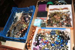 Two boxes of costume jewellery.