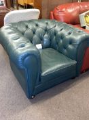 Green buttoned leather Chesterfield chair.
