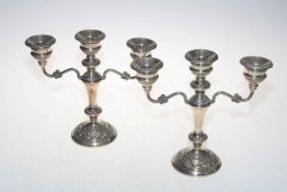 Pair of loaded silver ornate three branch candelabrum, Birmingham 1979, 23.5cm.