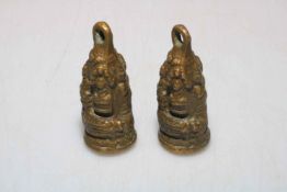 Two Chinese bronze opium weights.
