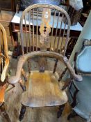 Antique yew broadarm Windsor chair with pierced splat back.