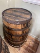 Oak and metal bound coopered barrel.