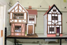 Two Tudor style dolls houses.
