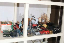 Collection of cameras, toy cars, action figures, two guitars, etc.