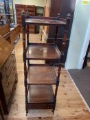 Victorian four tier mahogany whatnot having three shelves above a single drawer base raised on