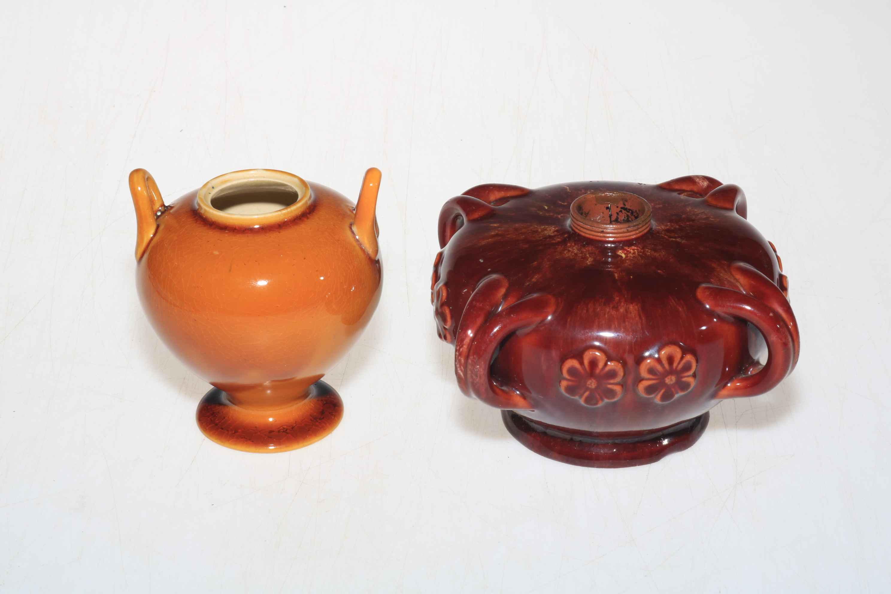 Linthorpe Pottery four handled lamp base no. 1456 and small two handled vase.