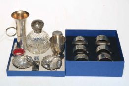 Silver items comprising set of six napkin rings, two spirit measure, egg cup, shell salts,