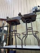 Pair of industrial metal swivel seated bar stools.