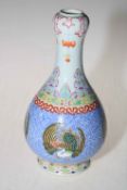 Chinese garlic vase, having four bird roundels on blue patterned ground, 23cm.