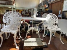 Ornate white painted metal garden table and four chairs.