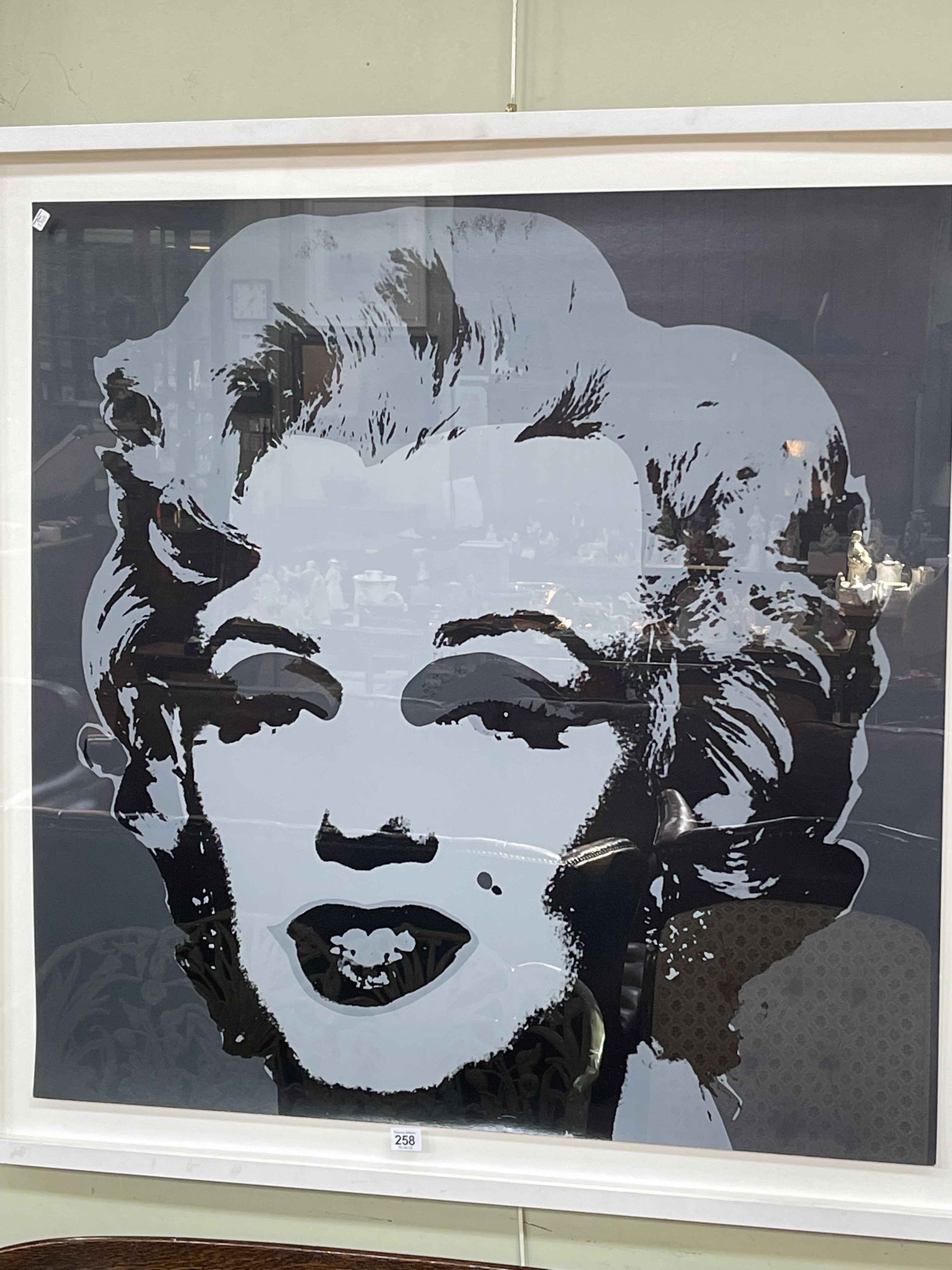 After Andy Warhol, monochrome portrait of Marilyn Monroe, 90cm by 90cm, framed.