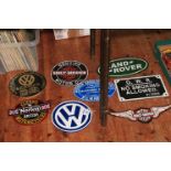 Eight assorted motoring signs including Harley Davidson, Norton, Land Rover, etc.