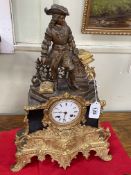 Ornate gilt metal mantel clock mounted with spelter figure, 46cm high.