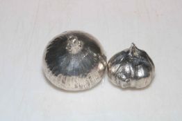 Two John silver onion paperweights.