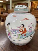 Chinese lidded ginger jar decorated with figures in landscape, 26cm high.
