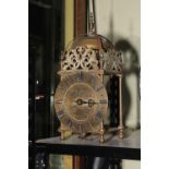 Brass lantern clock, the dial signed Thomas Moore, Ipswich, approximately 38cm high.