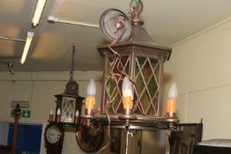 Pair of six branch centre ceiling lanterns with coloured glass panels.
