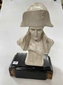 Pottery bust of Napoleon on an associated slate stand, 45cm high.
