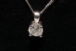 18 carat white gold and one carat round brilliant cut diamond pendant and fine link chain,