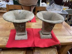 Pair of small cast iron urns, 25cm high.