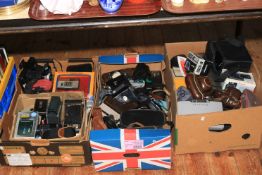 Three boxes of cameras, accessories including lenses, flashes, etc.