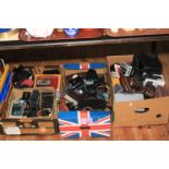 Three boxes of cameras, accessories including lenses, flashes, etc.