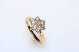 Diamond seven stone cluster and 18 carat gold ring, size L (total approximate 0.75 carat).