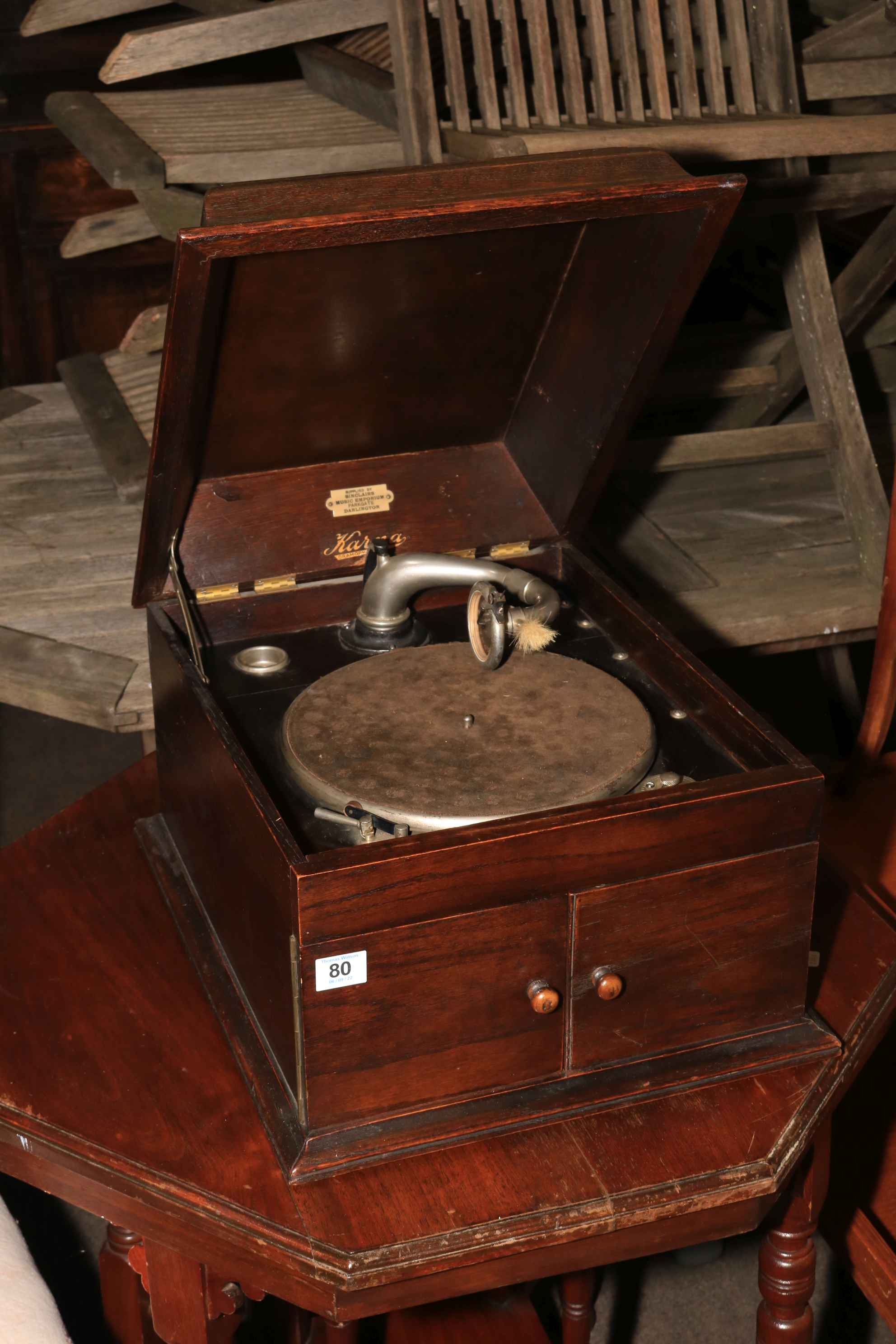 Karma table top gramophone with records.