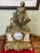 Ornate gilt metal and marble mantel clock with a Centurion mounted top, 57cm high.