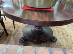 Victorian circular mahogany breakfast table on turned pedestal to three paw feet,