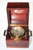 Matthew Norman gimballed ships clock in mahogany case, 17cm square.