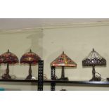 Four Tiffany style table lamps including a pair.