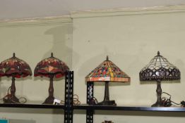 Four Tiffany style table lamps including a pair.
