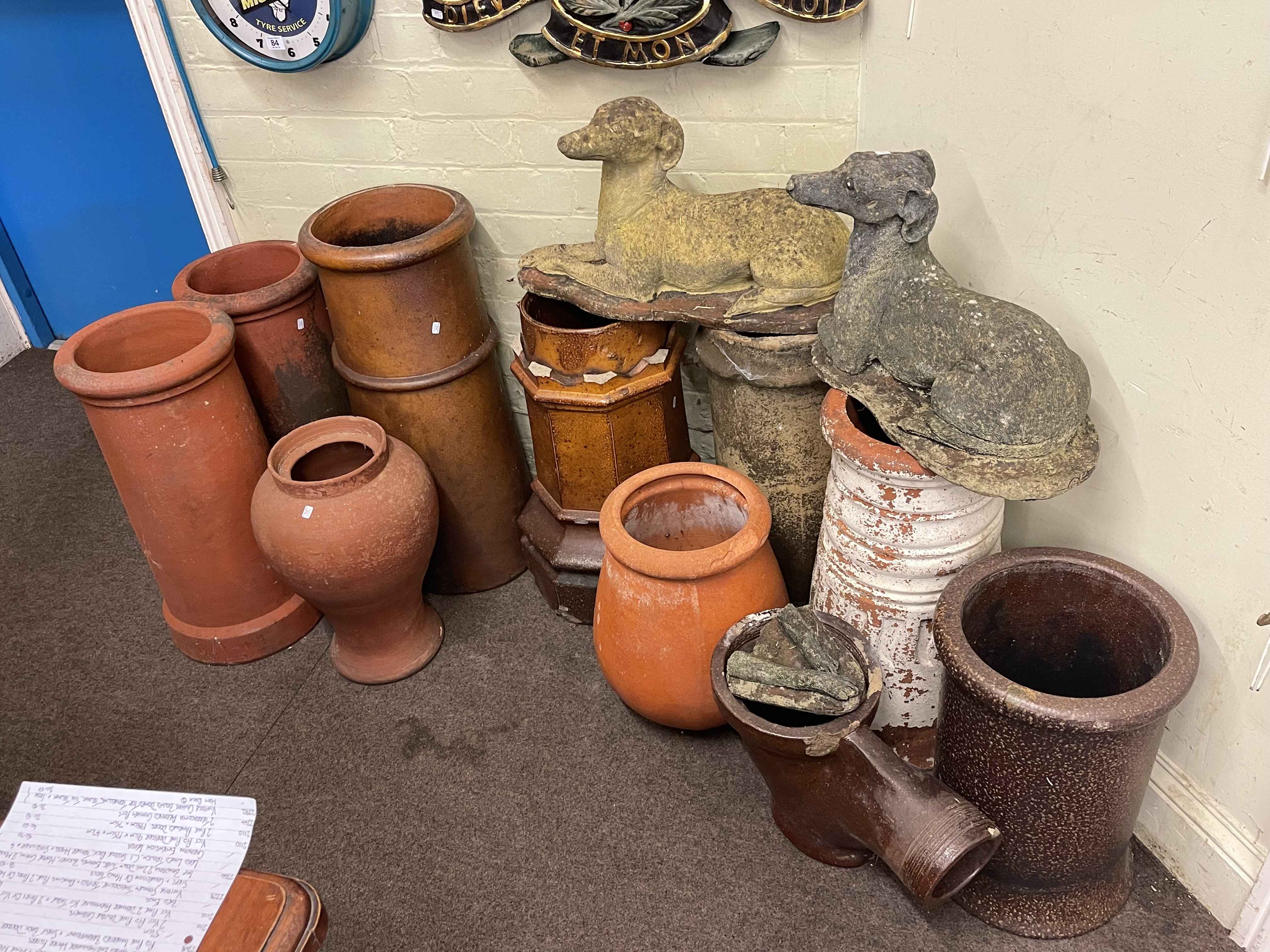 Collection of seven various salt glazed and terracotta chimney pots, two terracotta vases,
