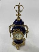 Ornate blue porcelain and brass mounted mantel clock, 43cm.