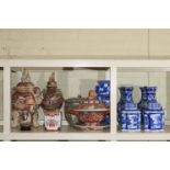 Collection of Oriental Ware including five blue and white vases and two lidded canisters,