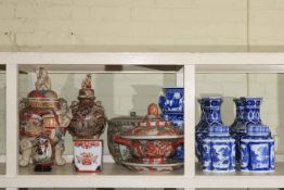 Collection of Oriental Ware including five blue and white vases and two lidded canisters,