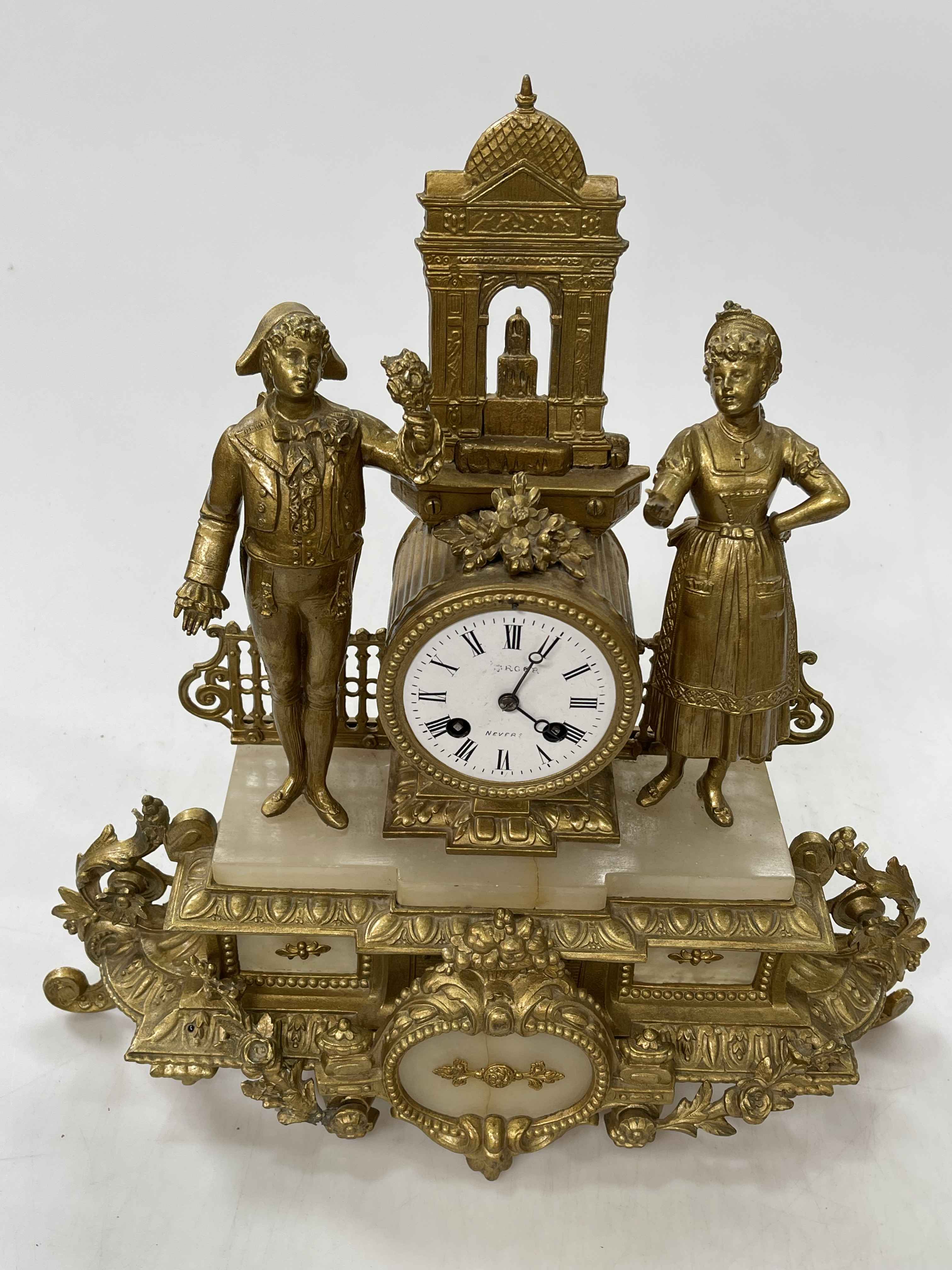 Ornate gilt metal mantel clock depicting Continental scene, 41cm high.