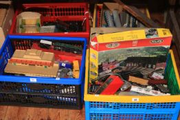 Four boxes of train carriages, models, accessories, etc.